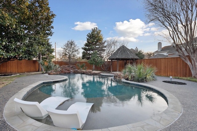 view of swimming pool with a fenced in pool and a fenced backyard