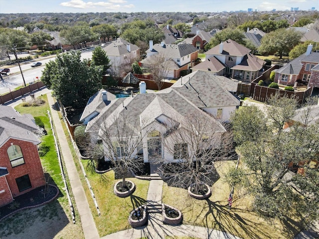 birds eye view of property with a residential view