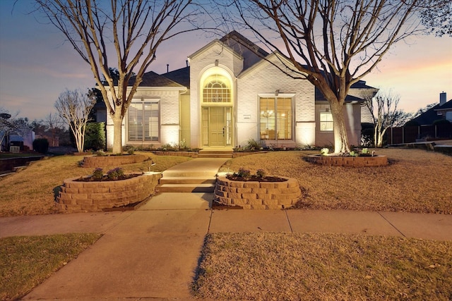 view of front of property featuring brick siding