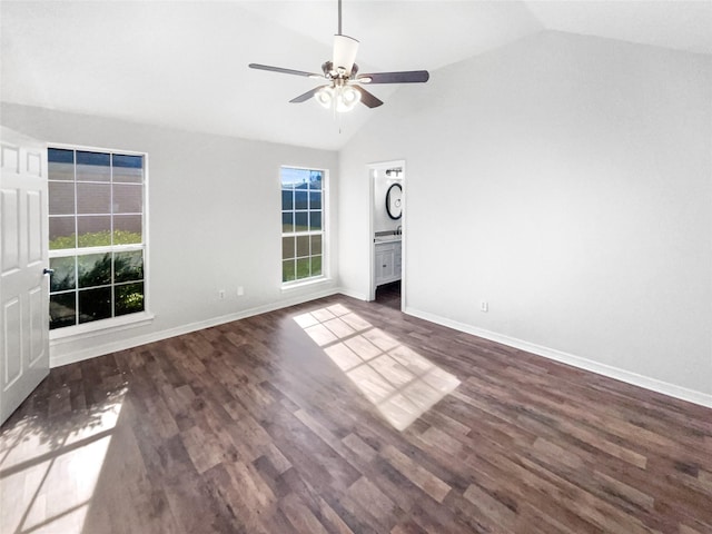 unfurnished bedroom featuring baseboards, dark wood finished floors, a ceiling fan, and vaulted ceiling