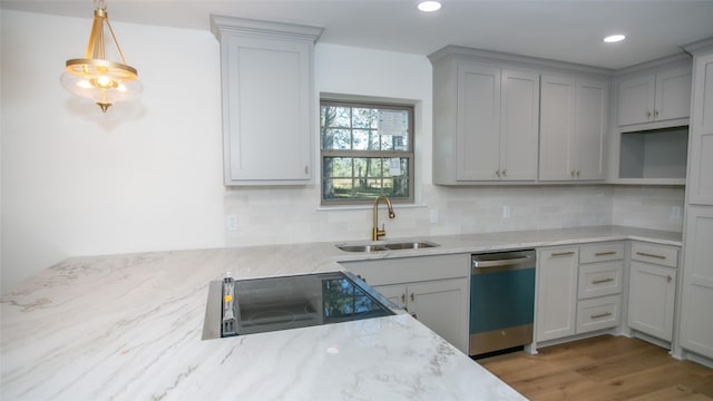 kitchen with dishwashing machine, electric range, backsplash, and a sink