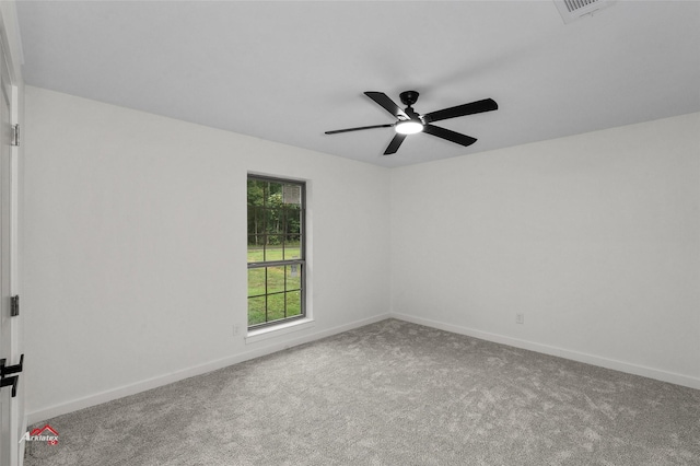 unfurnished room featuring baseboards, carpet floors, visible vents, and a ceiling fan