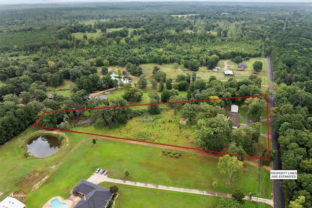 aerial view featuring a rural view and a view of trees