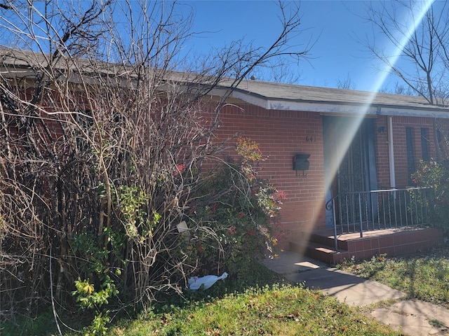 view of home's exterior featuring brick siding