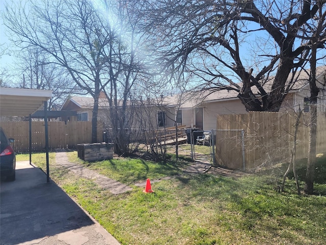 view of yard with a gate and fence