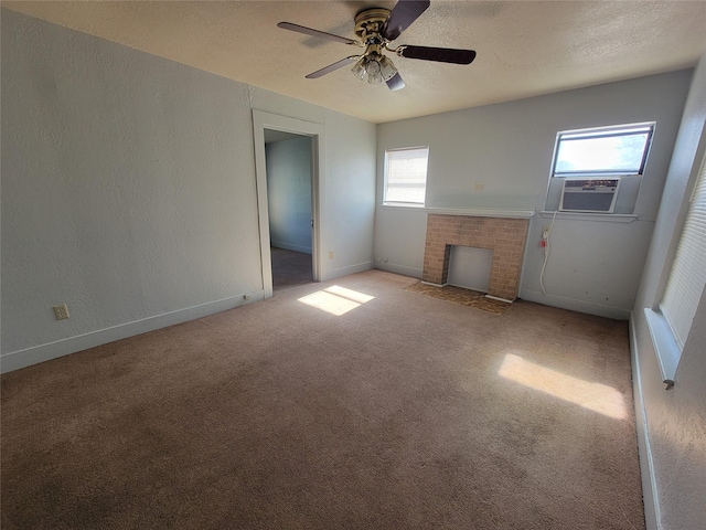 unfurnished room featuring light colored carpet, a fireplace, a textured ceiling, and a textured wall