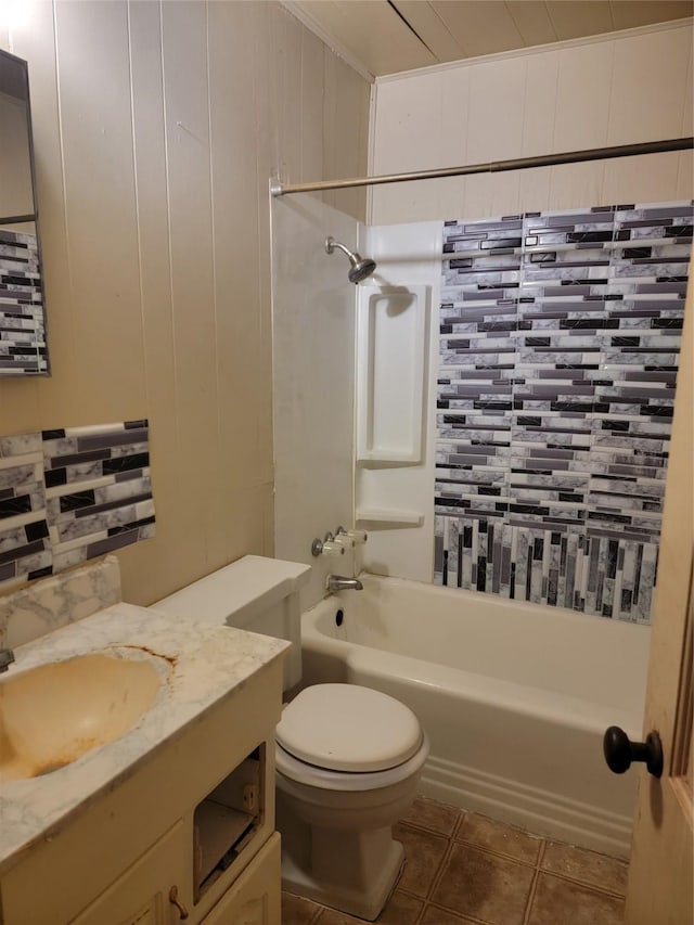 full bath featuring tile patterned flooring, toilet, vanity, and shower / washtub combination