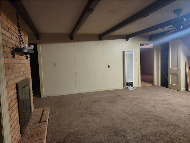 unfurnished living room featuring a brick fireplace, carpet floors, beam ceiling, a textured ceiling, and a ceiling fan