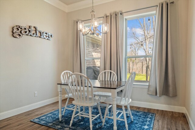 laundry room featuring crown molding, independent washer and dryer, cabinet space, and light wood-style flooring