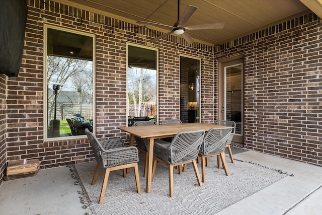 view of patio with outdoor dining space and ceiling fan