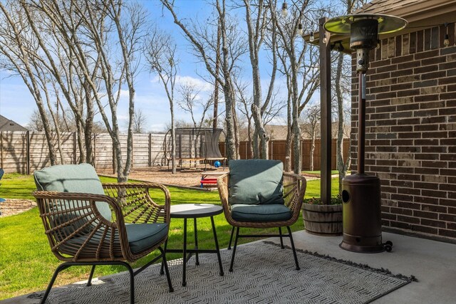 view of yard featuring a fenced backyard and a fire pit