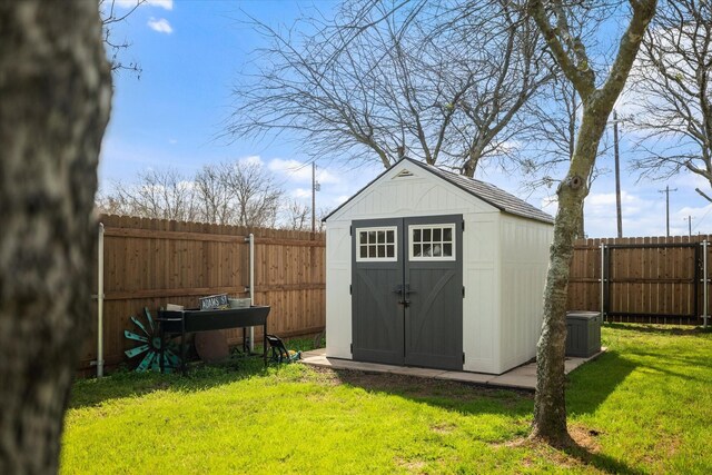 rear view of property with a patio, brick siding, fence, and a lawn