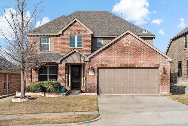 traditional-style home featuring brick siding, a front lawn, concrete driveway, roof with shingles, and a garage