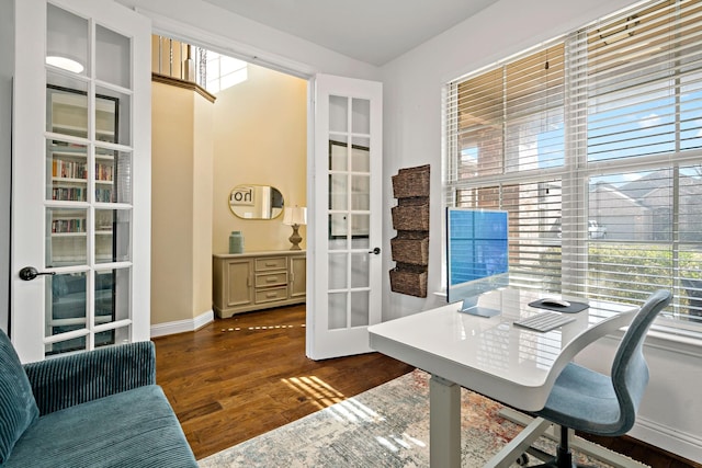 office with french doors, baseboards, and wood finished floors