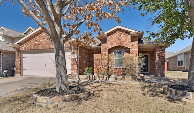 ranch-style home featuring brick siding, concrete driveway, and an attached garage