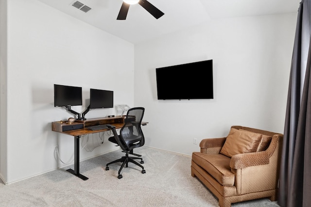 carpeted home office featuring visible vents, baseboards, lofted ceiling, and a ceiling fan