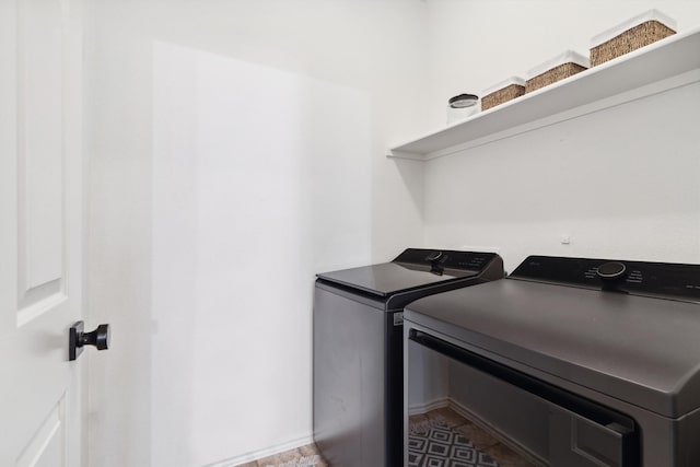 laundry room featuring independent washer and dryer and laundry area