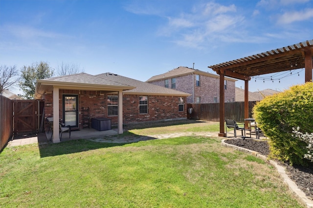 view of yard with a gate, a patio area, a pergola, and a fenced backyard