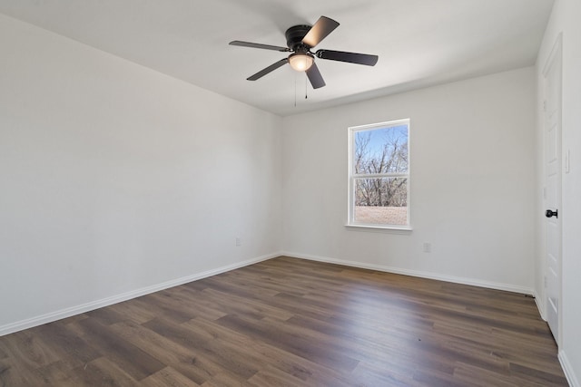 unfurnished room featuring ceiling fan, baseboards, and dark wood-style floors