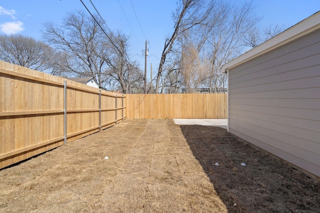 view of yard with a fenced backyard