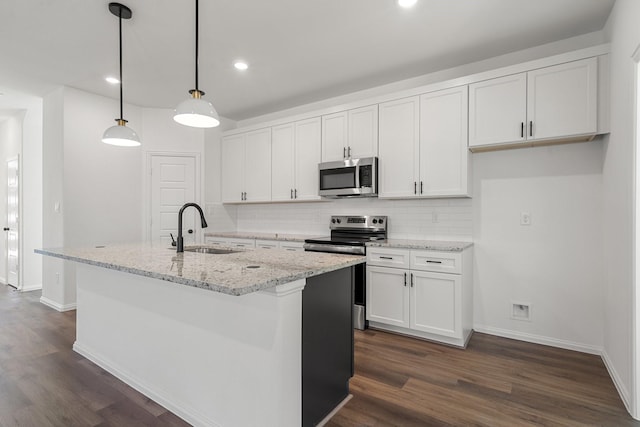 kitchen with decorative backsplash, appliances with stainless steel finishes, dark wood-style flooring, and a sink