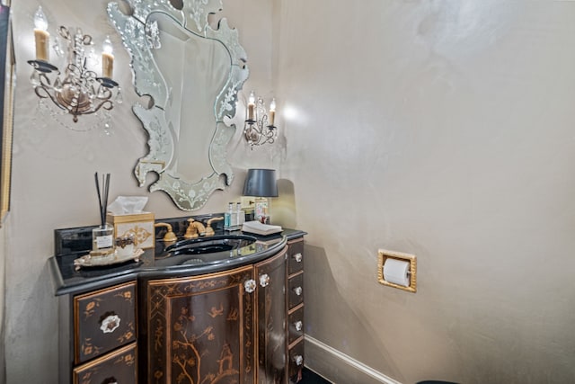 bathroom with vanity and baseboards