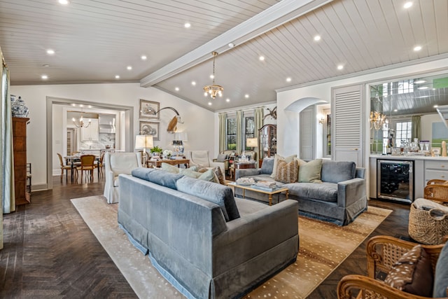 living room with a notable chandelier, recessed lighting, wine cooler, arched walkways, and vaulted ceiling with beams