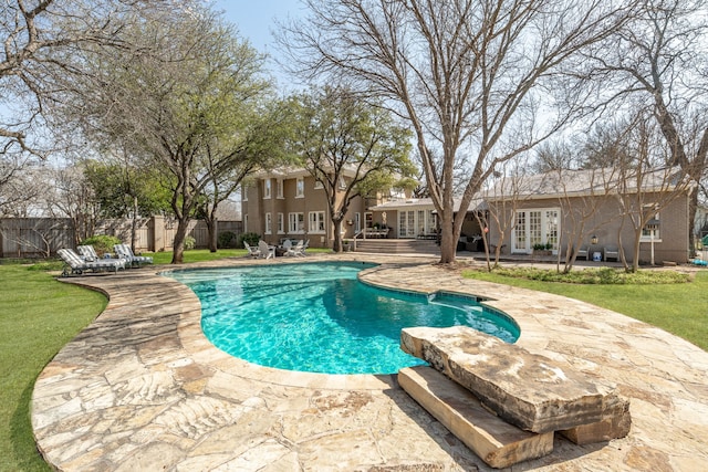 view of swimming pool with a patio area, a fenced in pool, french doors, and a fenced backyard