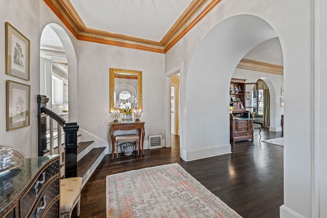 entrance foyer featuring visible vents, dark wood-type flooring, and baseboards