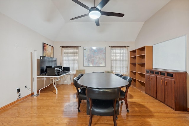 dining space with plenty of natural light, lofted ceiling, and light wood finished floors