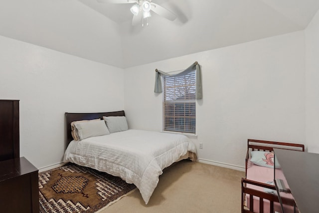 carpeted bedroom featuring a ceiling fan and baseboards