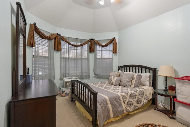 bedroom with light carpet and vaulted ceiling