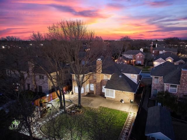 birds eye view of property with a residential view