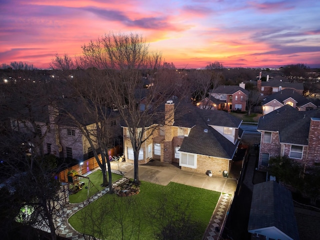 aerial view at dusk with a residential view