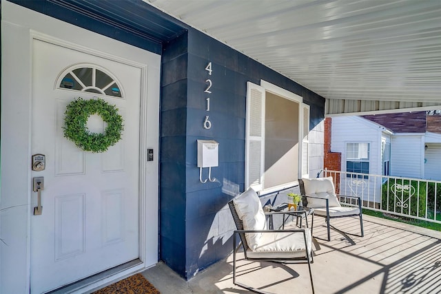 property entrance featuring covered porch