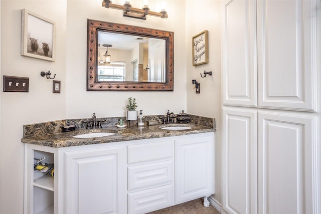 full bath featuring double vanity and a sink