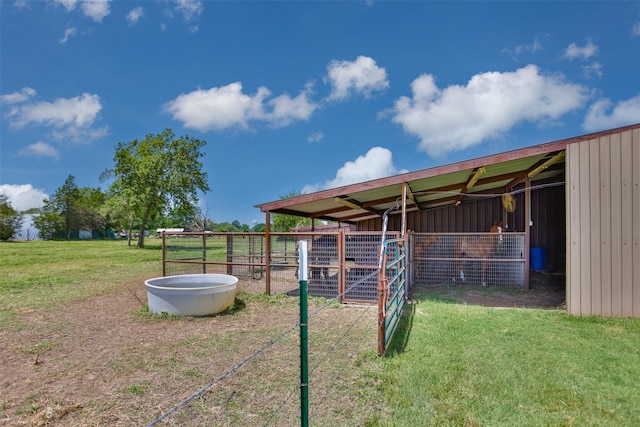 view of yard with an exterior structure and an outbuilding