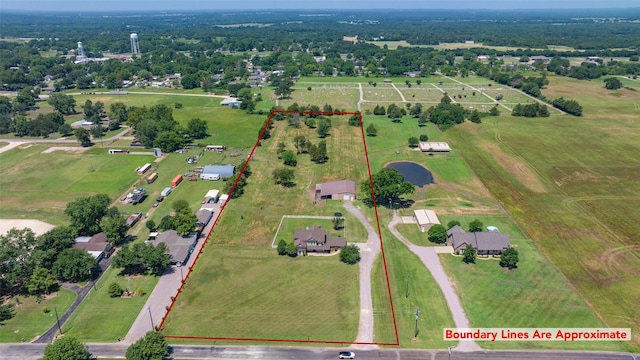 birds eye view of property featuring a rural view