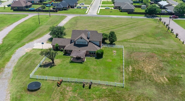 birds eye view of property with a rural view and a residential view