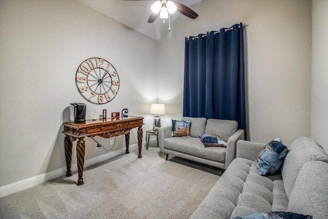 living area with baseboards, carpet floors, and a ceiling fan