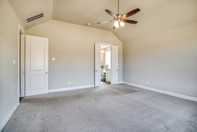 unfurnished bedroom with visible vents, baseboards, carpet, lofted ceiling, and ceiling fan