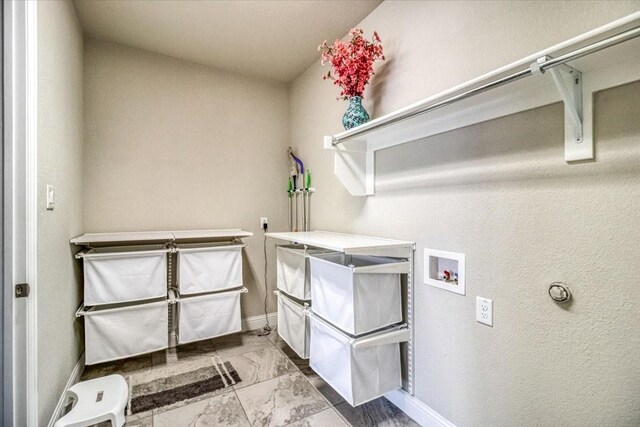 washroom with washer hookup, laundry area, baseboards, and marble finish floor