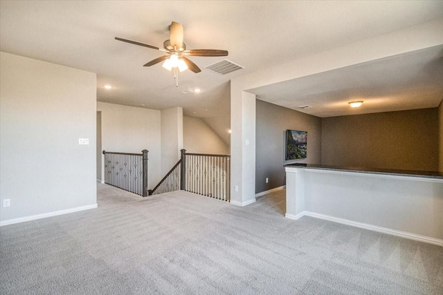 carpeted spare room with recessed lighting, visible vents, ceiling fan, and baseboards