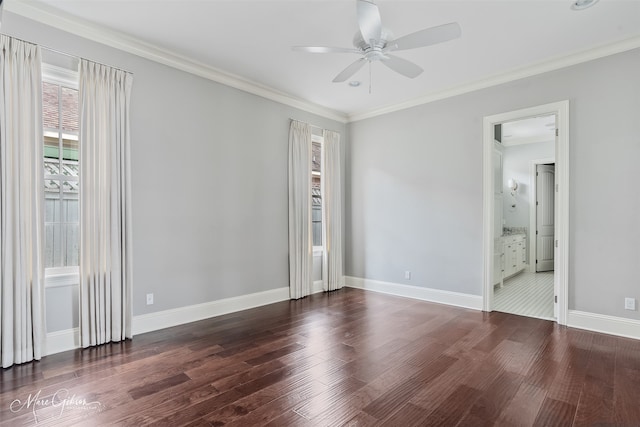 unfurnished bedroom with baseboards, multiple windows, and wood finished floors