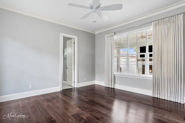 unfurnished room featuring crown molding, ceiling fan, wood-type flooring, and baseboards