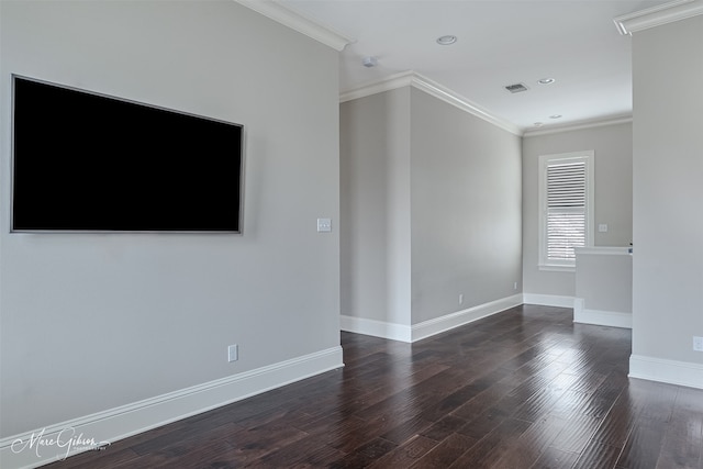 unfurnished room featuring dark wood finished floors, ornamental molding, visible vents, recessed lighting, and baseboards