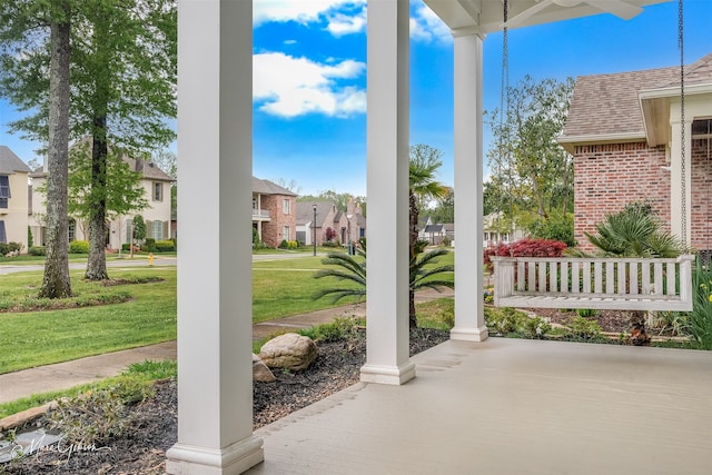 view of patio / terrace featuring covered porch and a residential view