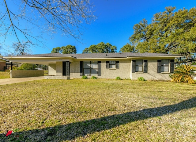 ranch-style house featuring a carport, concrete driveway, a front yard, and brick siding