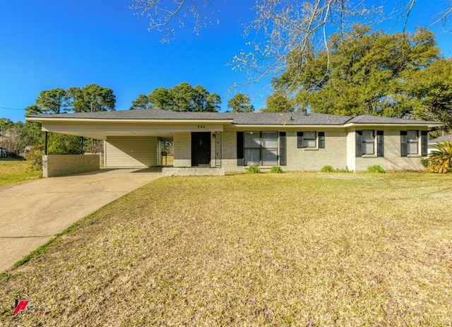 ranch-style house with brick siding, a carport, concrete driveway, and a front yard