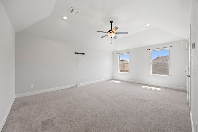 carpeted empty room with visible vents, a ceiling fan, recessed lighting, baseboards, and vaulted ceiling